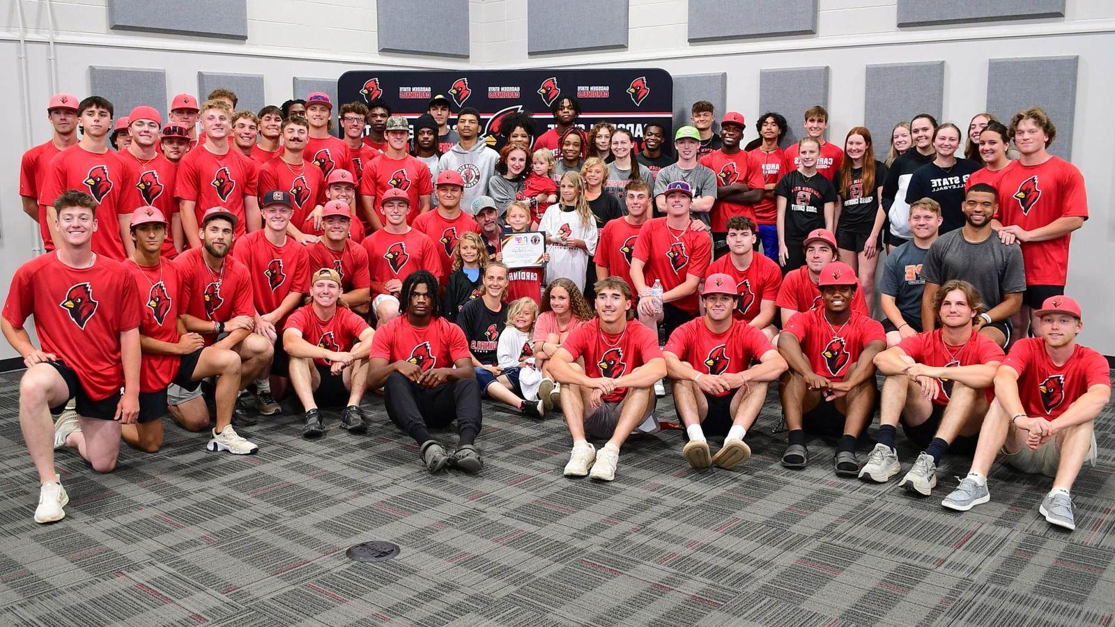 Members of Cardinal Athletics teams at a community event in the Beck Conference Center